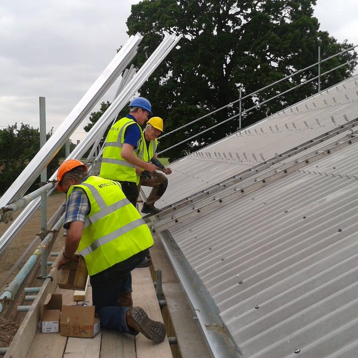 Three Installers on a roof