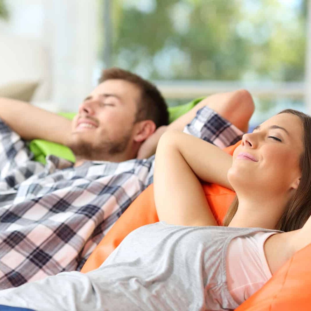 Couple of roommates relaxing Roommates relaxing at home